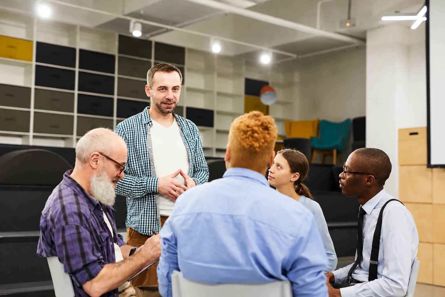Facilitator meeting with a professional training group